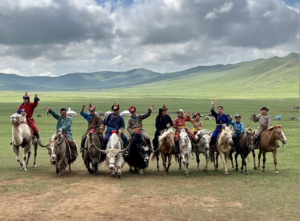 mongolian nomads riding horses, yaks, and camels